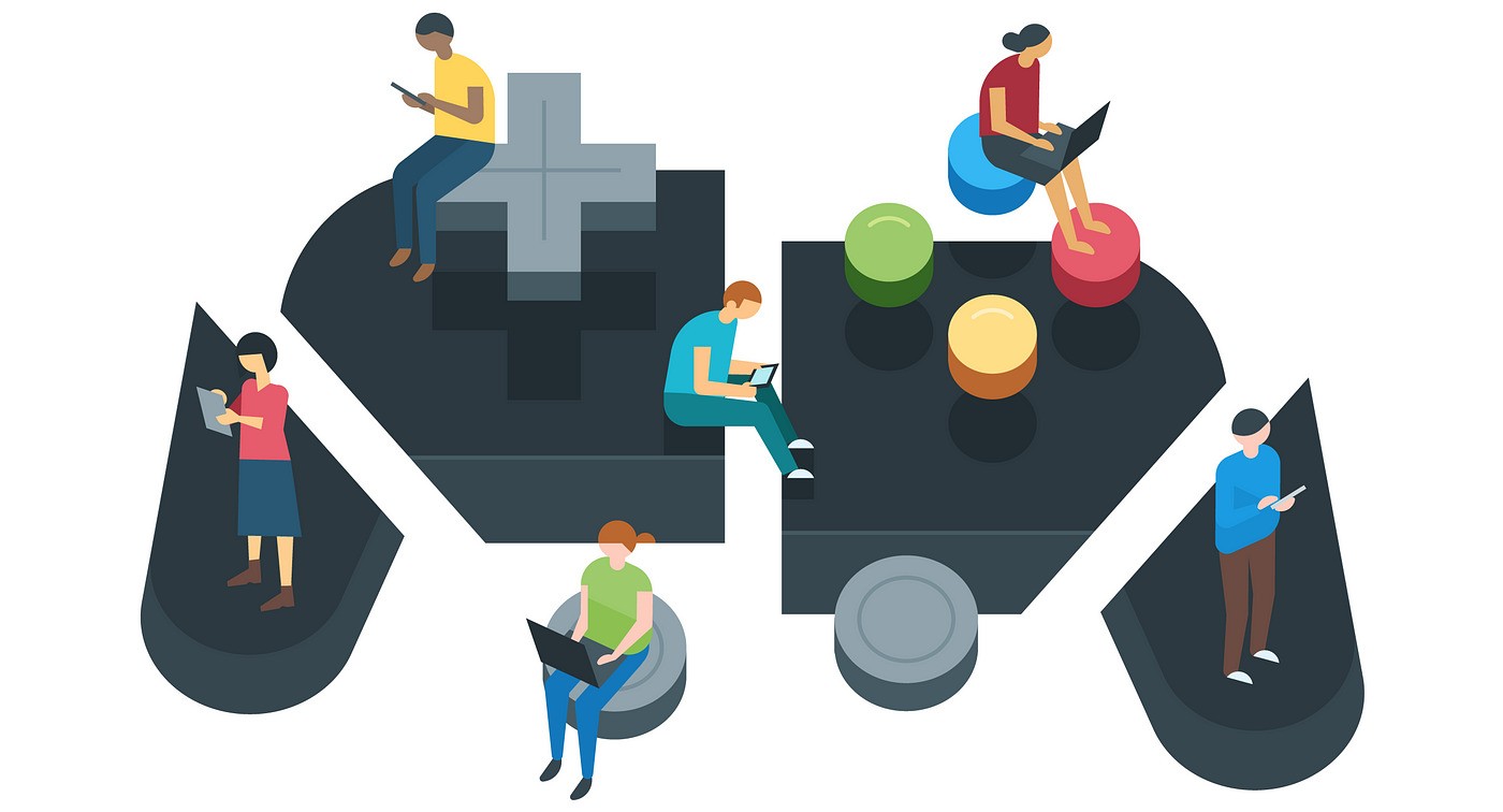 People sitting on a large game controller